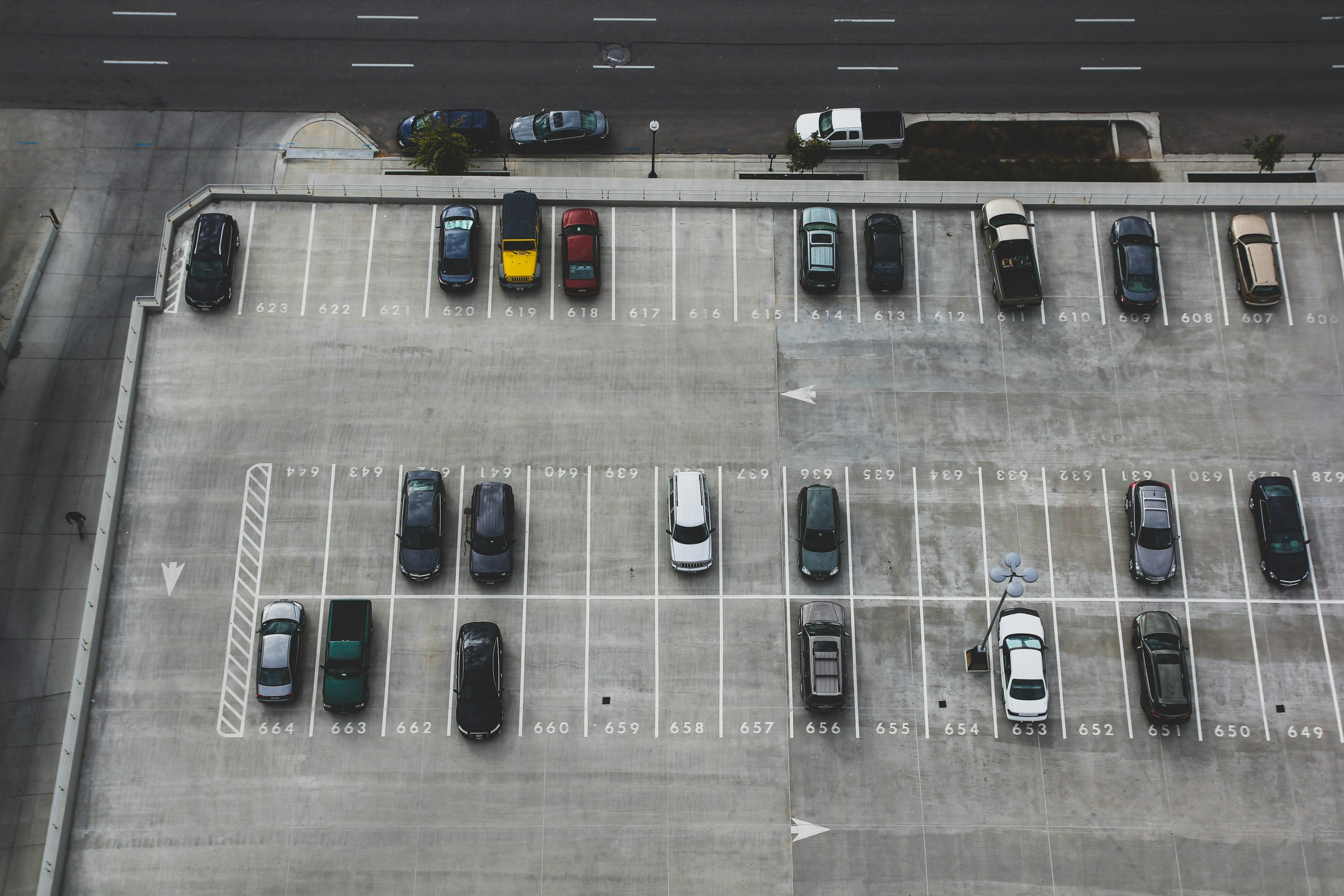 Aerial view of a professional parking lot with numbered spaces